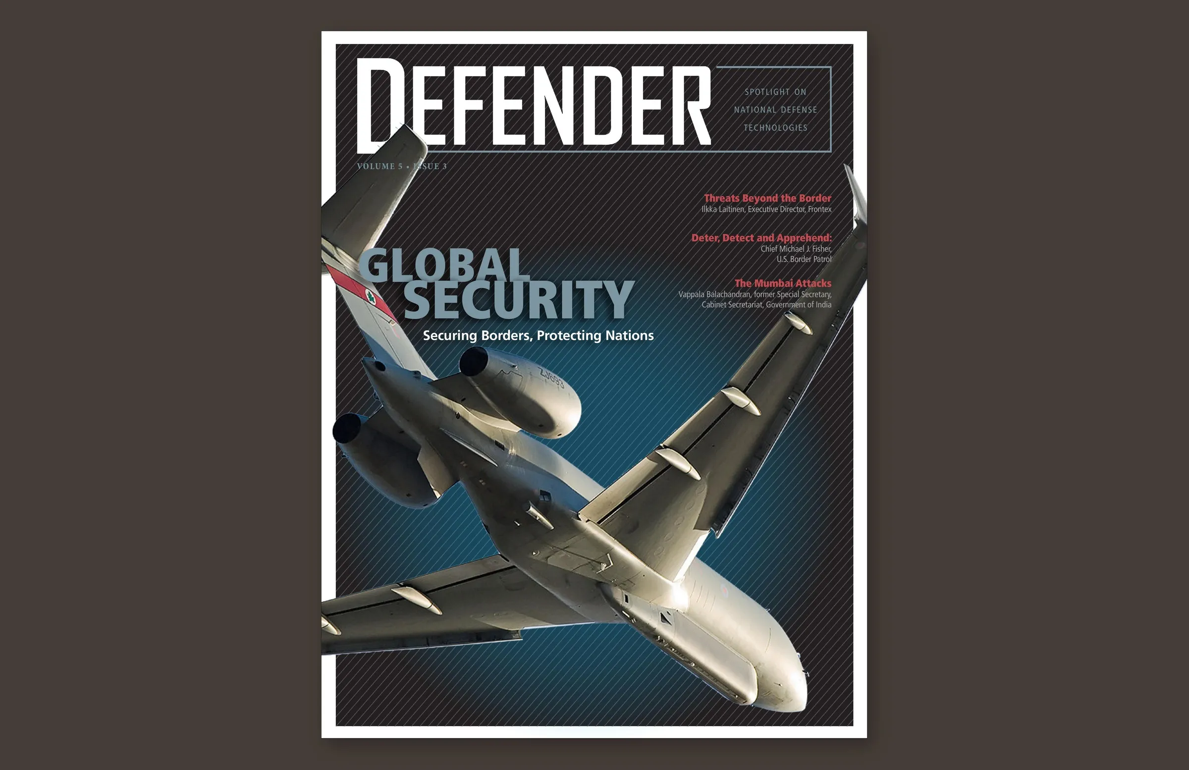Defender cover: a Sentinel surveillance jet banking against a dark pinstriped field beneath the redrawn masthead, with the cover line Global Security.
