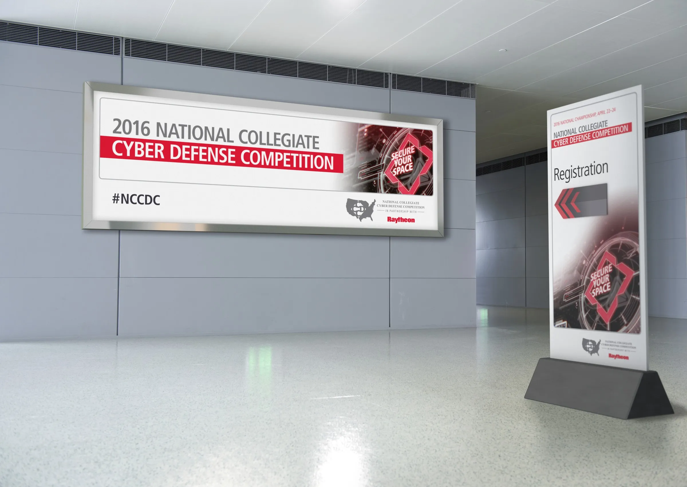 Event signage in a convention concourse: a wall-mounted championship banner beside a freestanding registration tower.