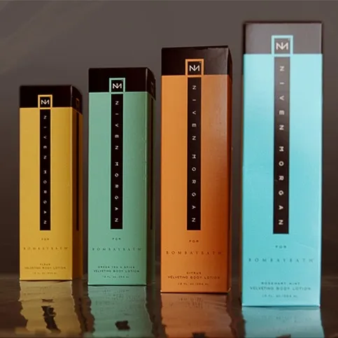 Four Niven Morgan for Bombay Bath cartons in a row, each a different scent colour, with the monogram and vertical name band on the face.