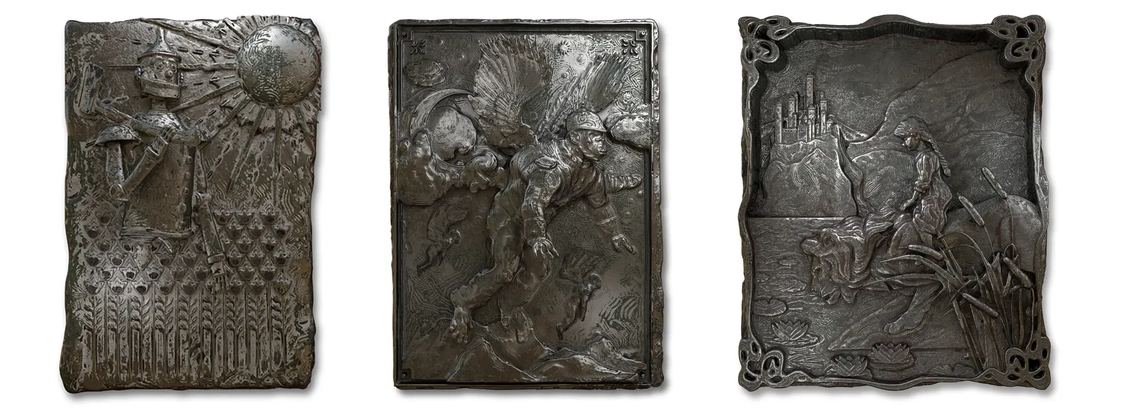 The three cast metal panels of the Wizard of Oz series side by side: the Tin Man before a rising sun, a flying monkey in mid-air, and Dorothy with the Cowardly Lion.